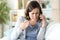 Angry middle age woman arguing calling on phone at home