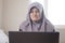 Angry Muslim Businesswoman Working on Laptop, Bad Economic Concept