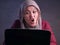 Angry Muslim Businesswoman Working on Laptop at the Office