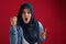 Angry muslim woman wearing hijab looking at camera and shouting, person having conflict