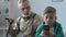 Angry old man scolding grandson playing smartphone game, family misunderstanding