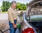 Angry Older Man Pumps Gas As Fuel Prices Rise REVISED