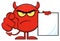 Angry Red Devil Cartoon Emoji Character Pointing With Finger And Holding A Blank Sing.