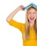 Angry student girl with book over head