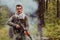 Angry terrorist militant guerrilla soldier warrior in forest