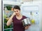 Angry and upset housewife looking into pot with foul meal