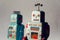 Angry vintage tin toy robots, artificial intelligence, robotic delivery concept