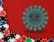 Angry virus on red background next to poker chips