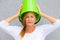 Angry woman with bucket on head