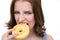 Angry woman eating doughnut