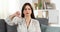 Angry woman gesturing thumb down at home