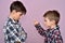 Angry young boy scolding a brother