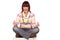 Angry young woman sitting cross-legged, isolated