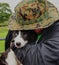 Animal Lover Hugs a Puppy Sheep Dog in Wales, U.K.