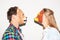Animal mask, party and a couple on a white background for fun, bonding or comedy. Funny, character and a man and woman