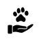 Animal Paw and Human Hand Silhouette Icon. Animal Donation, Care and Protection concept. Adoption of Pets, Shelter