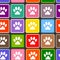 Animal paw prints on colored squares seamless pattern.