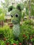 An animal shaped bush in the Gardens, The tree is trimmed to the