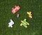 Animal themed wooden puzzle on grass. Educational activity. Mental skill development. Children\\\'s toys.