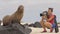 Animal wildlife nature photographer tourist looking at Galapagos Sea Lion