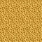Animalistic seamless pattern giraffe skin, imitation of a giraffe pattern on yellow orange brown fabric