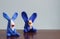 Animals blue rabbits from multi-colored plasticine, which hardens. Children`s creativity. Funny clay toys