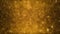 Animated background of defocused golden particles