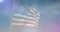 Animation of american flag over stunning clouds and sky