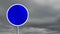 Animation of blue round road sign and clouds in sky in the background