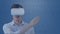 Animation of businessman wearing vr headset over binary coding