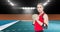 Animation of caucasian female handball player holding ball over sports stadium