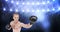 Animation of caucasian male boxer boxing over spotlight in sports stadium