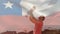 Animation of chilean flag over caucasian father holding up baby on beach