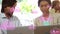 Animation of cloud icons with increasing percentage over diverse man and woman discussing at office