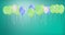 Animation of colourful balloons bouncing on green background