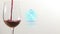 Animation of digital clock over glass of wine on white background