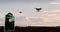 An animation of a drone flying near an airport with a aircraft departing in the background and a no drone sign in the