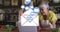 Animation of envelope mail icons over senior couple using laptop at home