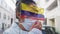 Animation of flag of colombia over woman wearing face mask