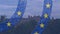 Animation of flag of european union over castle and landscape