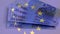 Animation of flag of european union over euro currency banknotes