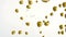 Animation of gold balloons rising, with uncut diamonds falling on white background