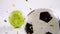 Animation of gold confetti falling over soccer ball and bowling ball