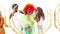 Animation of gold pattern over diverse happy children and clown having fun at party, waving