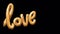 Animation golden LOVE balloons on black background.