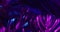 Animation of green lush leaves over purple background with neon purple lighting