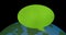 Animation of green speech bubble over globe on black background