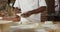 Animation of hand of african american male baker preparing sourdough for bread