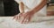 Animation of hand of asian female baker preparing sourdough for bread