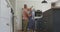 Animation of happy caucasian senior couple dancing in kitchen